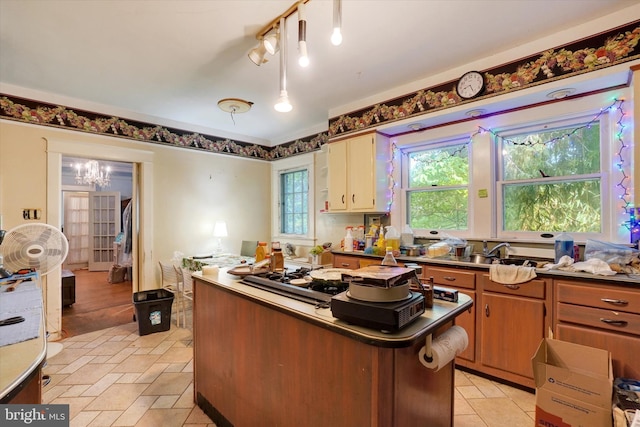 100 Springdale Rd, York, PA 17403 - kitchen featuring a center island, stainless steel gas stovetop, dark countertops, and a desk