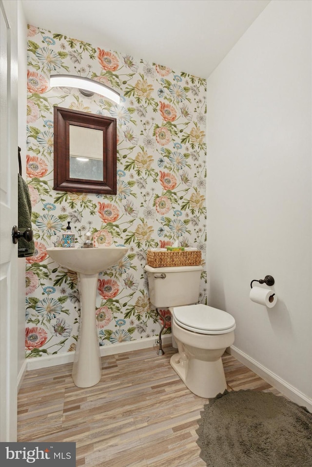 1009 Red Rock Cir, Royersford, PA 19468 - half bathroom featuring wallpapered walls and wood finished floors