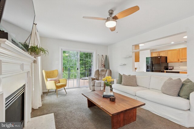 1009 Red Rock Cir, Royersford, PA 19468 - living area with carpet, ceiling fan, a fireplace with flush hearth, and recessed lighting