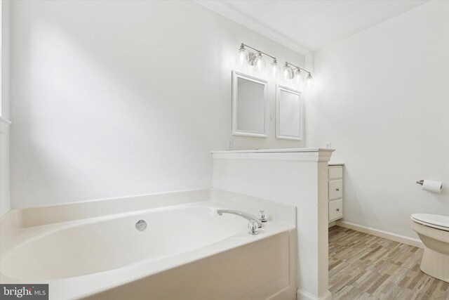 1009 Red Rock Cir, Royersford, PA 19468 - bathroom with a bath, vanity, and wood finished floors