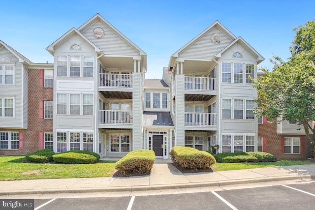 25909 Ridge Manor Dr Unit A, Damascus, MD 20872 - view of building exterior featuring uncovered parking