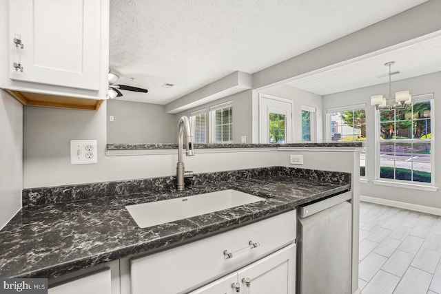 25909 Ridge Manor Dr Unit A, Damascus, MD 20872 - kitchen with dishwasher, white cabinets, a chandelier, ceiling fan, and a textured ceiling