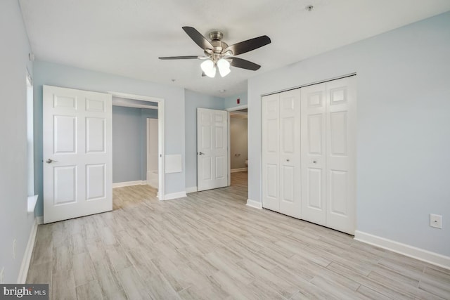 25909 Ridge Manor Dr Unit A, Damascus, MD 20872 - unfurnished bedroom with light wood-style flooring, a closet, and a ceiling fan