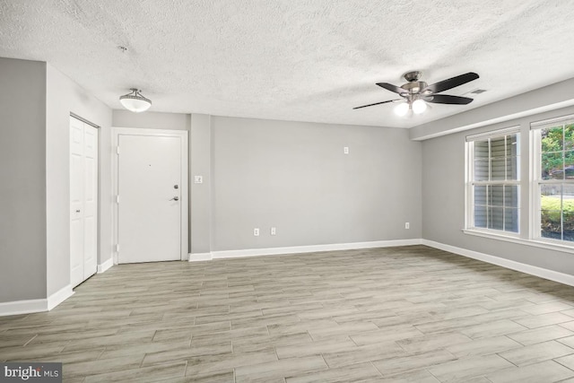 25909 Ridge Manor Dr Unit A, Damascus, MD 20872 - spare room with ceiling fan, a textured ceiling, and wood finished floors