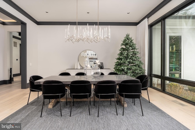 1020 Langley Hill Dr, Mclean, VA 22101 - dining room with a chandelier, light wood finished floors, and crown molding