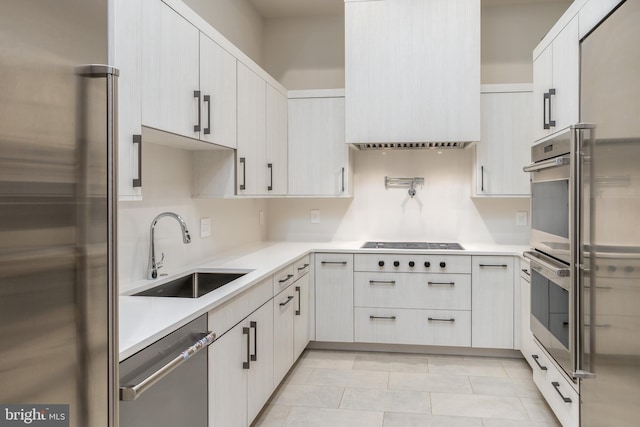 1020 Langley Hill Dr, Mclean, VA 22101 - kitchen with appliances with stainless steel finishes, light countertops, tasteful backsplash, and light tile patterned floors