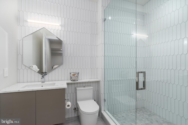 1020 Langley Hill Dr, Mclean, VA 22101 - bathroom with tile walls, vanity, and a stall shower
