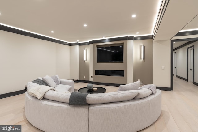 1020 Langley Hill Dr, Mclean, VA 22101 - cinema room with recessed lighting, light wood-type flooring, and a glass covered fireplace