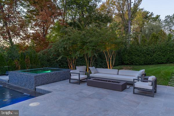 1020 Langley Hill Dr, Mclean, VA 22101 - view of patio featuring an in-ground hot tub, an outdoor living space with a fire pit, and an outdoor pool