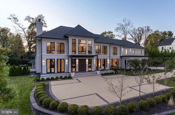 1020 Langley Hill Dr, Mclean, VA 22101 - rear view of house featuring a chimney and a lawn