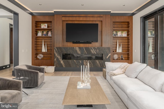 1020 Langley Hill Dr, Mclean, VA 22101 - living room featuring wood finished floors, built in shelves, and a premium fireplace