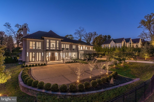 1020 Langley Hill Dr, Mclean, VA 22101 - rear view of property featuring a balcony, french doors, a chimney, and stucco siding