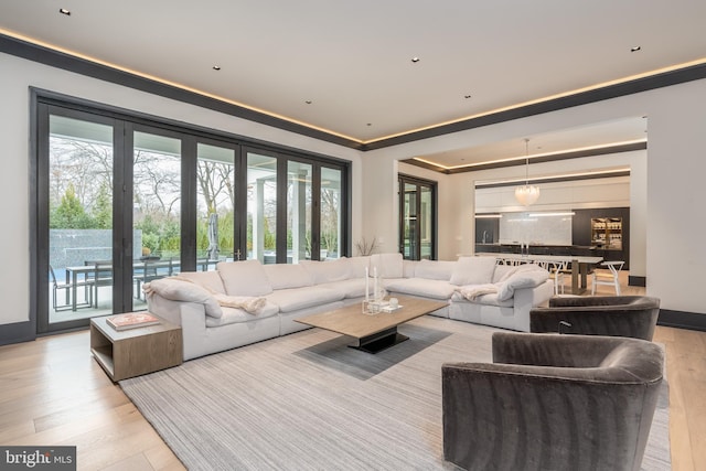 1020 Langley Hill Dr, Mclean, VA 22101 - living area with healthy amount of natural light, french doors, wood finished floors, and crown molding
