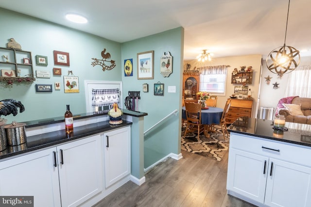 3 Cawdor Ln, New Castle, DE 19720 - bar area featuring light wood-style floors and hanging light fixtures