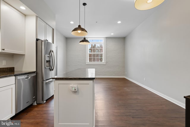 413 Jefferson St Unit 3, East Greenville, PA 18041 - kitchen with stainless steel appliances, dark stone countertops, white cabinets, dark wood-style floors, and recessed lighting