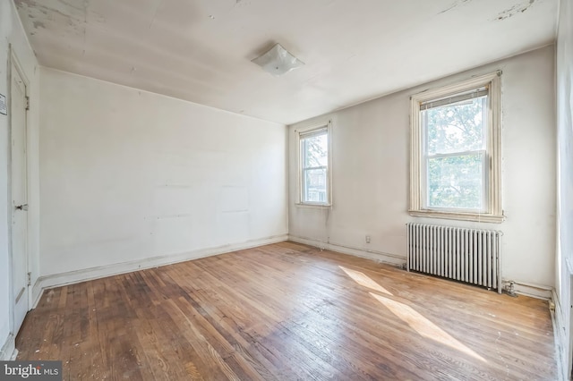 2704 N Tatnall St, Wilmington, DE 19802 - spare room with radiator and hardwood / wood-style flooring