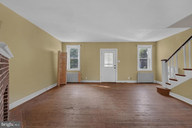 2704 N Tatnall St, Wilmington, DE 19802 - entryway featuring radiator, wood finished floors, and stairway
