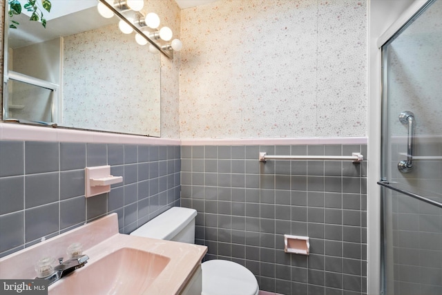 575 Wanamaker Rd, Jenkintown, PA 19046 - full bath featuring tile walls, wallpapered walls, a shower with shower door, wainscoting, and vanity