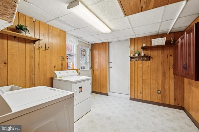575 Wanamaker Rd, Jenkintown, PA 19046 - laundry room featuring light flooring, wood walls, and washing machine and clothes dryer