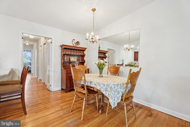 575 Wanamaker Rd, Jenkintown, PA 19046 - dining room with light wood-style flooring and a chandelier
