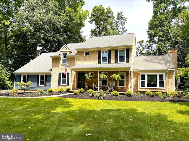 20 Heron Hill Dr, Downingtown, PA 19335 - traditional-style home with a porch, a front yard, and a chimney