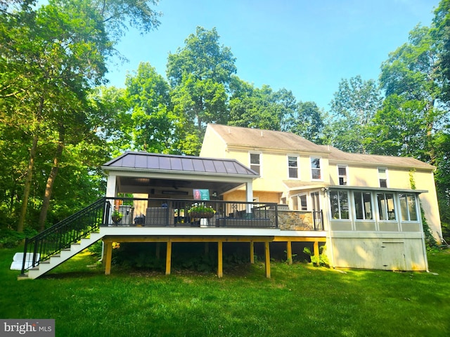 20 Heron Hill Dr, Downingtown, PA 19335 - rear view of property with a sunroom, stucco siding, a yard, a wooden deck, and stairway