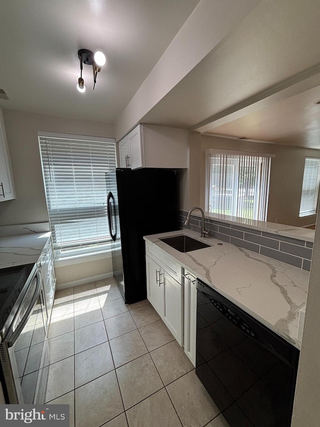 11900 Filly Ln, Gaithersburg, MD 20878 - kitchen with black appliances, white cabinetry, light stone counters, light tile patterned floors, and decorative backsplash