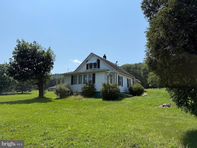 11 Gray Ridge Ln, Berkeley Springs, WV 25411 - view of property exterior with a yard and a chimney
