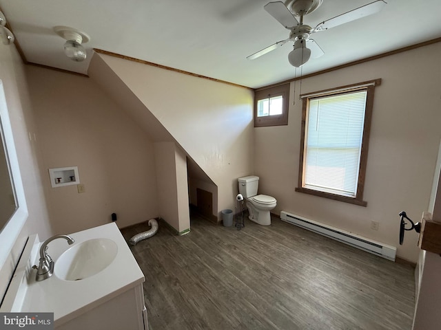 11 Gray Ridge Ln, Berkeley Springs, WV 25411 - bathroom with a baseboard heating unit, vanity, a ceiling fan, and wood finished floors