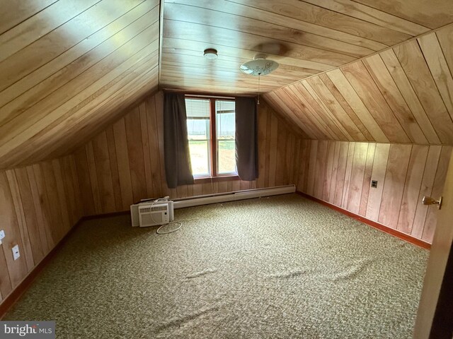 11 Gray Ridge Ln, Berkeley Springs, WV 25411 - additional living space featuring baseboard heating, wood walls, carpet flooring, lofted ceiling, and a wall unit AC