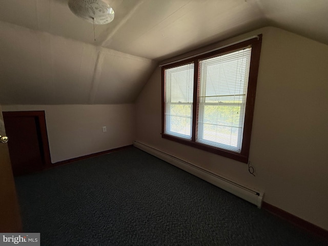 11 Gray Ridge Ln, Berkeley Springs, WV 25411 - additional living space with baseboard heating, vaulted ceiling, and dark colored carpet