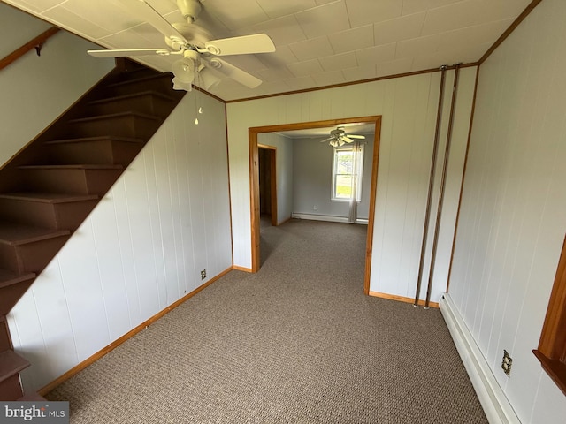 11 Gray Ridge Ln, Berkeley Springs, WV 25411 - carpeted empty room with a ceiling fan, a baseboard radiator, and wood walls