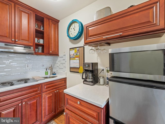 7 45th St Unit 209, Ocean City, MD 21842 - kitchen with electric stovetop, under cabinet range hood, stainless steel microwave, and backsplash