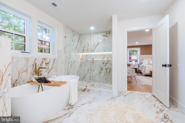 5303 Rolling Rd, Springfield, VA 22151 - ensuite bathroom featuring marble tiled floors, a marble finish shower, a freestanding tub, and recessed lighting