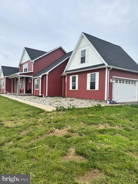 3671 Taneytown Rd, Gettysburg, PA 17325 - view of home's exterior featuring an attached garage, a yard, and board and batten siding
