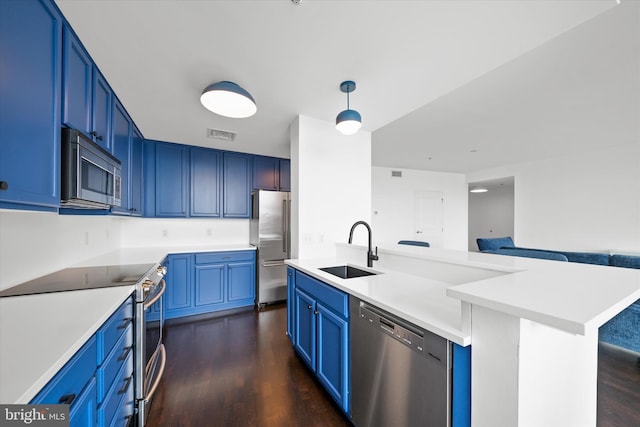 105 Christina Lndg Unit 1402, Wilmington, DE 19801 - kitchen featuring appliances with stainless steel finishes, dark wood-type flooring, open floor plan, blue cabinets, and light countertops