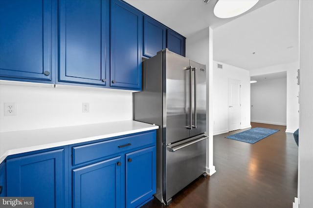 105 Christina Lndg Unit 1402, Wilmington, DE 19801 - kitchen with high end refrigerator, blue cabinetry, dark wood-style flooring, and light countertops