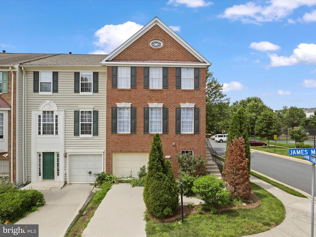 2516 James Maury Dr, Herndon, VA 20171 - view of property featuring concrete driveway, an attached garage, and brick siding