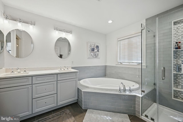 25369 Peaceful Ter, Aldie, VA 20105 - full bathroom with double vanity, a bath, a shower stall, tile patterned flooring, and recessed lighting