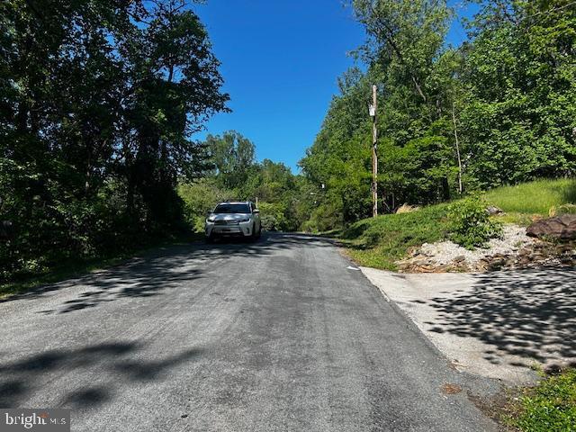 81 Mile Trl, Fairfield, PA 17320 - view of asphalt road featuring a wooded view