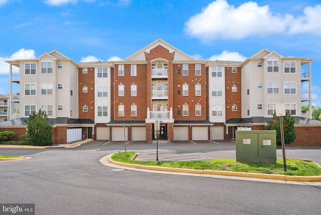 9710 Handerson Pl Unit 1, Manassas Park, VA 20111 - view of building exterior with a garage and driveway