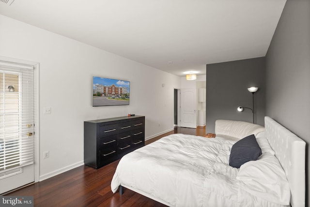 9710 Handerson Pl Unit 1, Manassas Park, VA 20111 - bedroom with dark wood-style flooring and baseboards