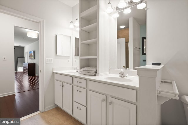 9710 Handerson Pl Unit 1, Manassas Park, VA 20111 - bathroom with double vanity and baseboards