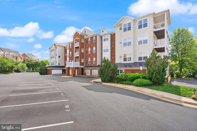 9710 Handerson Pl Unit 1, Manassas Park, VA 20111 - view of property featuring uncovered parking and a residential view