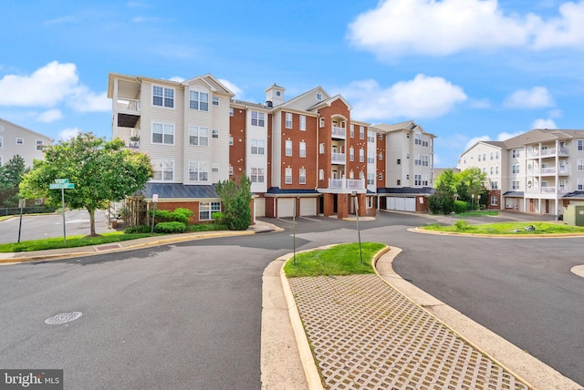 9710 Handerson Pl Unit 1, Manassas Park, VA 20111 - view of property featuring a residential view and an attached garage