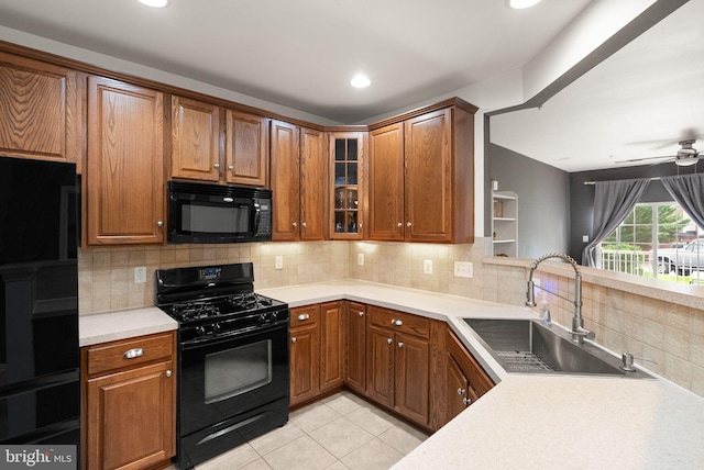 9710 Handerson Pl Unit 1, Manassas Park, VA 20111 - kitchen with black appliances, light tile patterned flooring, light countertops, tasteful backsplash, and glass insert cabinets