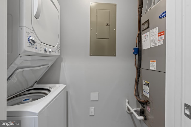 413 Jefferson St Unit 5, East Greenville, PA 18041 - washroom featuring stacked washing machine and dryer, electric panel, and heating unit
