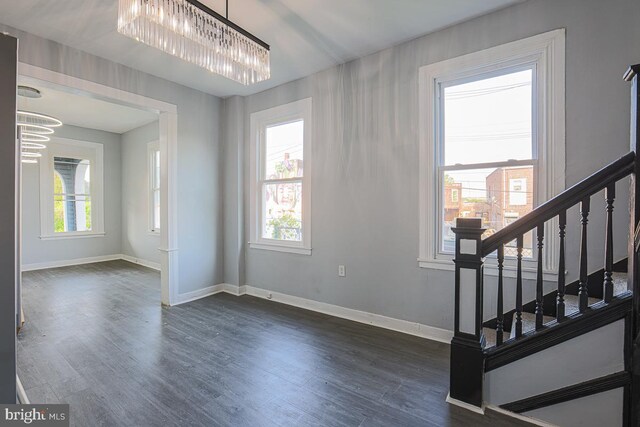 604 E 31st St, Baltimore, MD 21218 - entryway featuring a chandelier, stairs, and dark wood-type flooring