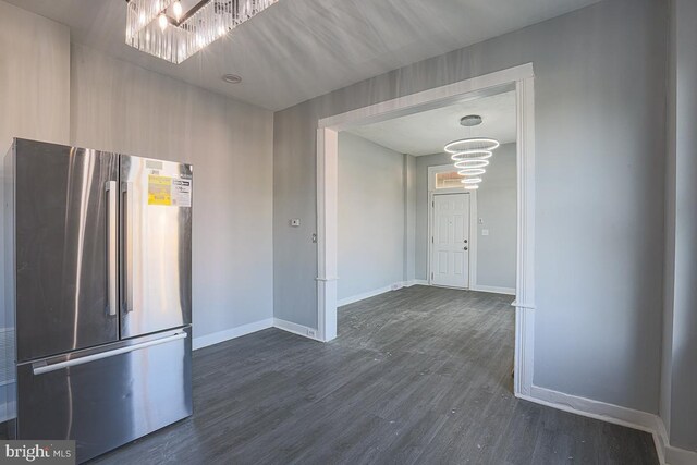 604 E 31st St, Baltimore, MD 21218 - kitchen featuring freestanding refrigerator, a chandelier, and dark wood finished floors