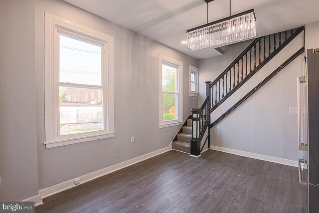 604 E 31st St, Baltimore, MD 21218 - stairway with wood finished floors and a chandelier